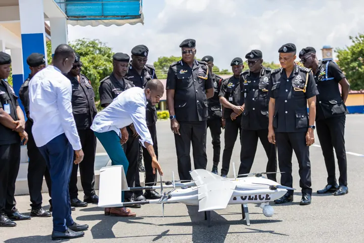 Altair engineer demonstrating a VTOL aircraft to Ghana Police Service personnel